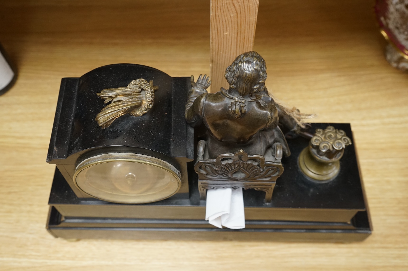 A 19th century French bronze and slate 8 day mantel clock, mounted with figure of Denis Diderot (1713-1784), 40cm wide